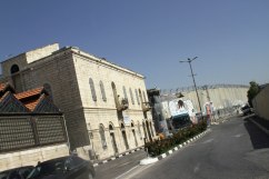 A massive wall with barbed wire separates the inhabitants of Bethlehem and Jerusalem.